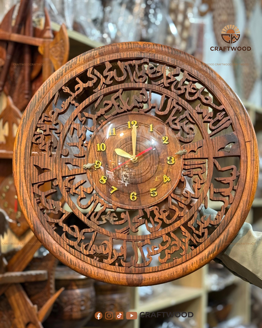 Wooden wall clock with intricate carvings and 'Craftwood' branding.