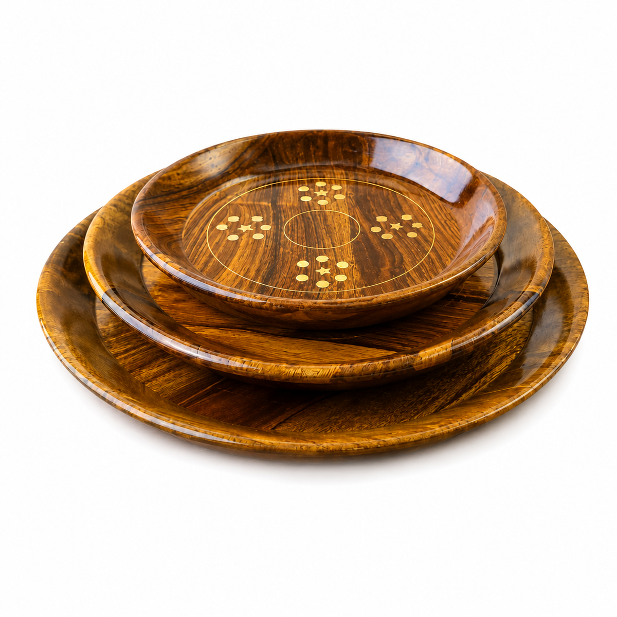 Three nested round wooden serving platters in varying sizes, featuring a rich dark brown wood grain and small gold-colored geometric inlays on the top plate, set against a plain white background.