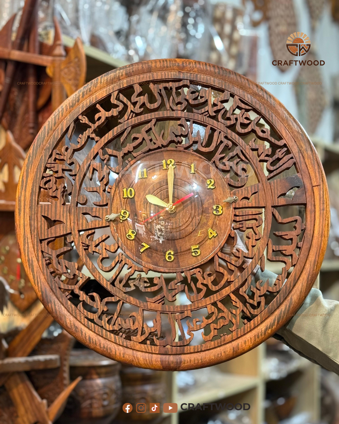 Wooden wall clock with intricate carvings and 'CRAFTWOOD' branding.